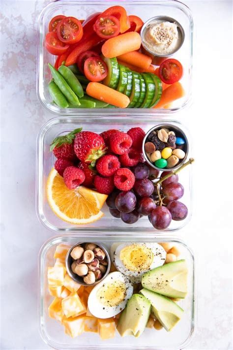 Three Glass Meal Prep Containers Filled With Raw Vegetables Mixed