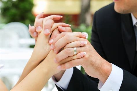 Clasped Hands Of Bride And Groom Stock Photo Image Of Husband Couple