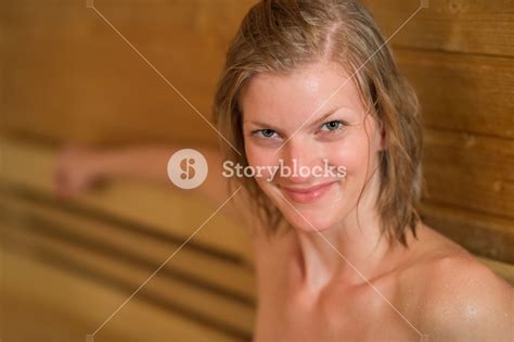Closeup Of Smiling Sweaty Woman In Sauna Royalty Free Stock Image