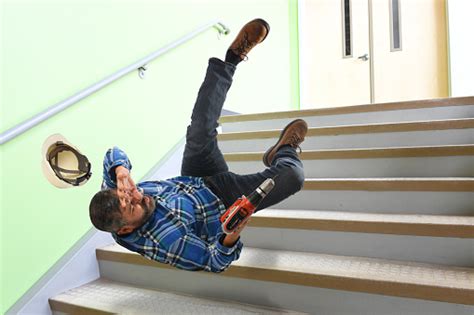 Senior Worker Falling On Stairs Stock Photo Download Image Now