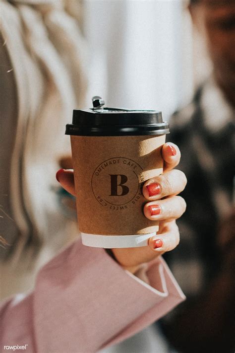 Female Hand Holding A Coffee Cup Mockup Premium Image By