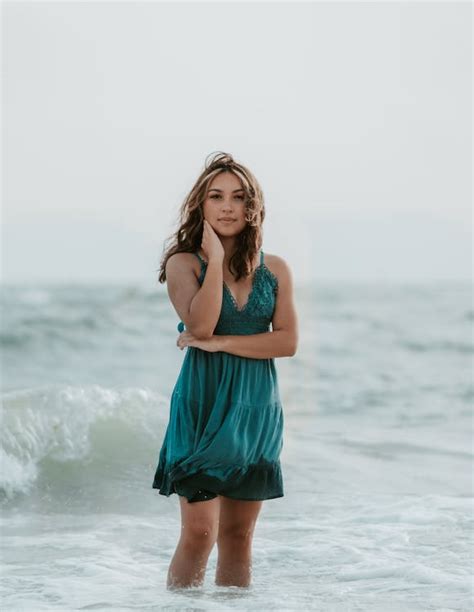 A Portrait Of Female Wading In Water And Wearing Wet Dress · Free Stock