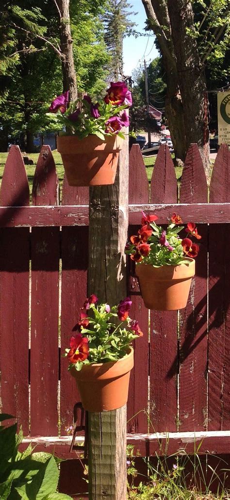 Diy A Seasonal Flower Pole Sink A Fence Post Attach Hangapot Hangers