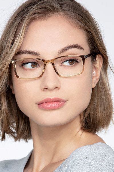 these eyeglasses are demure yet daring this full acetate frame features a striped bro… womens