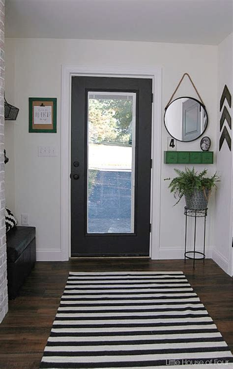 Add a mudroom bench to provide a comfortable sitting place to remove or store muddy boots. Thrifty DIY Mudroom Reveal | Little House of Four ...