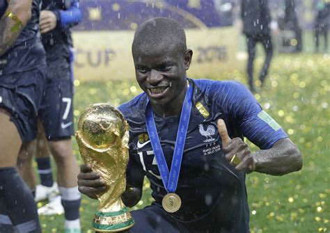 Kanye smiling and showing his super white teeth! Non-League Footballer Gets N'Golo Kante's Face Tattooed On His Back - SPORTbible