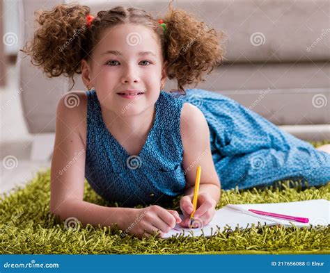 Young Little Girl Drawing On Paper With Pencils Stock Photo Image Of