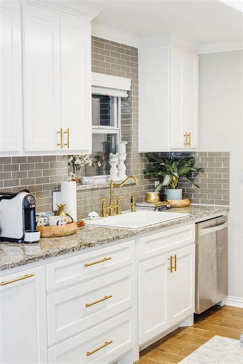 Keep your kitchen cabinets up to date with a modern makeover. Our Kitchen Sink Woes + Our Small Kitchen Reveal | Vandi Fair