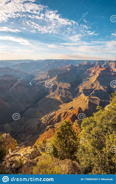 Beautiful Vertical Shot Of Landscape Of The Grand Canyon Under A Blue
