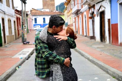 Traveling Photographer Captures Couples Kissing In Public Around The World