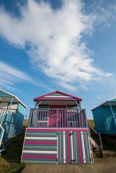 Colourful Wooden Beach Huts Facing The Ocean At Whitstable Coast Kent