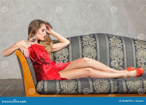 Young Woman Sitting On Sofa Stock Image Image Of Beauty Feminine 36488795