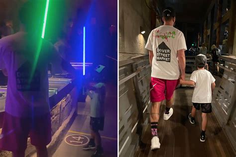 justin timberlake shares rare photos of son silas 6 as pair play with lightsabers at disney