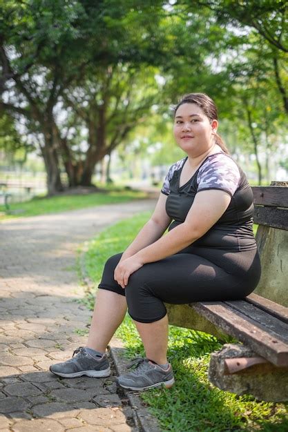 Premium Photo Asian Fat Woman Relaxing Exercise At The Nature Park In