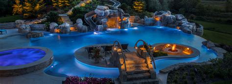 Waterfalls provide a fun place to splash or soak with. Platinum Pools designs, builds, and services inground ...