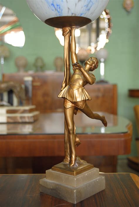 It has the form of a simplified figurine of a nude. Art Deco Lady Lamp || Cloud 9, Art Deco Furniture Sales