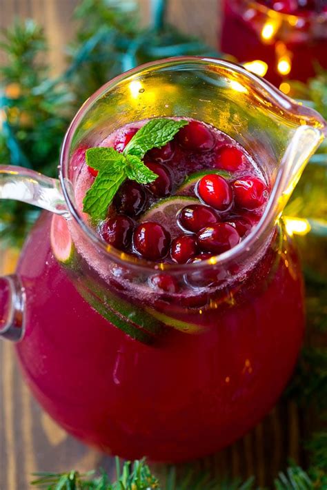A Pitcher Of Christmas Punch Made With Pomegranate Lime And Cranberry