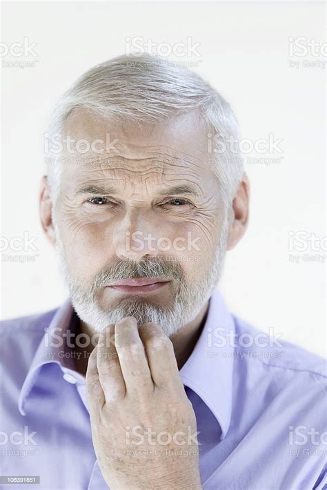 Man Senior Portrait Frowning Thinking Suspicious Mistrust Stock Photo