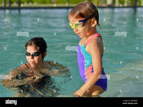 Mother Teaches Daughter To Swim Riverway Pool Townsville Queensland