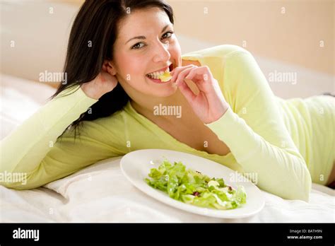 Girl Eating Salad Stock Photo Alamy