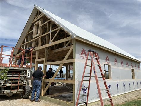 Attic Style Post Frame Being Built House Styles Pole Barn Building