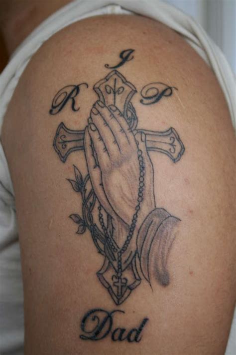 This tattoo design with praying hands and a cross is perfect for religious guys. Praying Hands/Cross tattoo