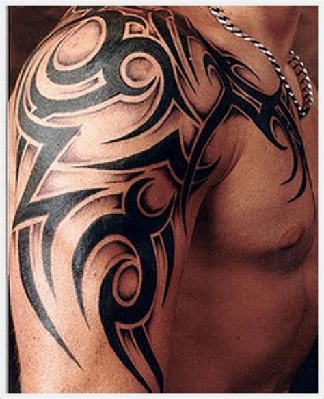 Black Ink Tribal Tattoo On Half Sleeve And Chest