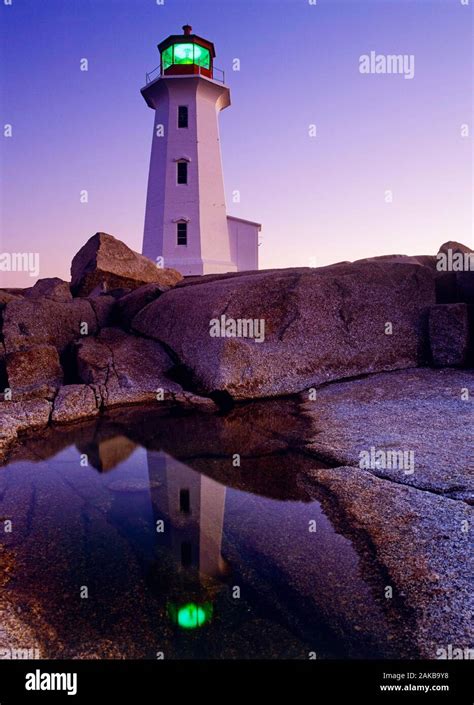 Peggys Cove Lighthouse At Sunset Peggys Cove Nova Scotia Canada