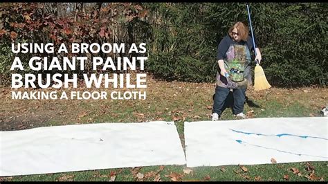 How To Use A Broom As A Giant Paint Brush While Making A Floor Cloth