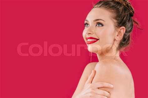 smiling naked beautiful woman with red lips isolated on red stock image colourbox