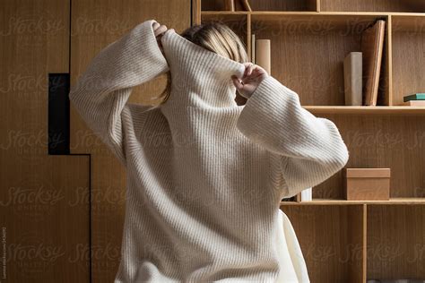 Woman Taking Off Her Sweater By Stocksy Contributor Lumina Stocksy