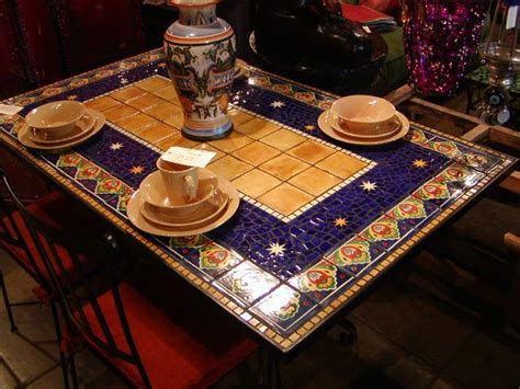This dining mosaic table set would look great in your patio, doesn't come with six wrought iron chairs, all unique & hand forged in casbalanca. http://www.furthurla.com/images/blconcha_wstars.JPG ...