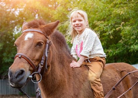 Happy Little Girl Riding A Horse Bareback Stock Image Image Of Saddle