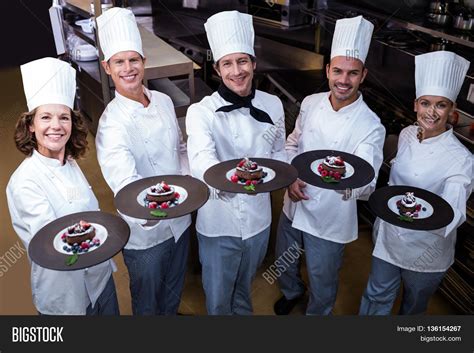 Happy Chefs Presenting Image And Photo Free Trial Bigstock
