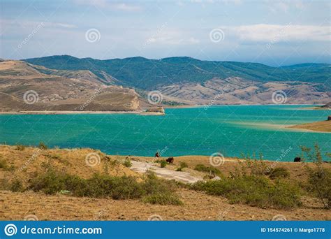 Turquoise Mountain Lake Among Brown Rocks And Sand Stock Image Image