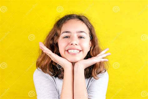 cute teenager girl with funny face smiling palms on the cheeks stock image image of laughing