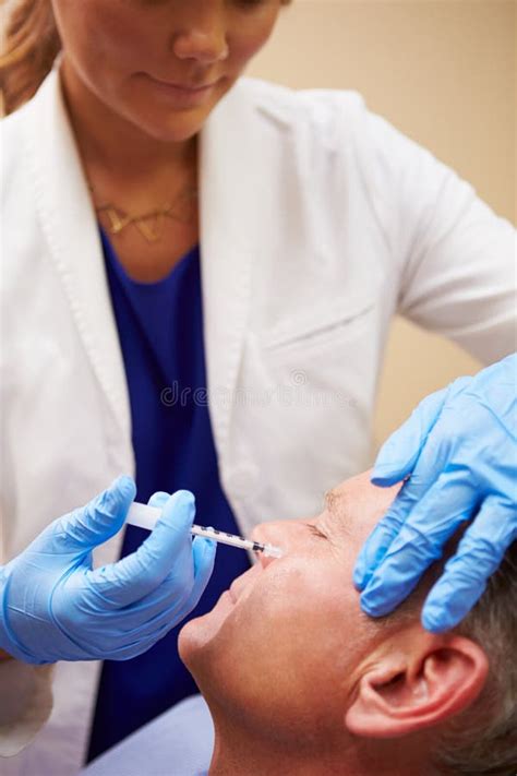 Man Having Botox Treatment At Beauty Clinic Stock Photo Image Of Male