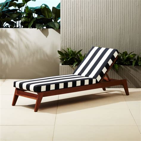 Find the perfect outdoor cushions and cushion covers at spotlight. filaki lounger with black and white stripe cushion | CB2