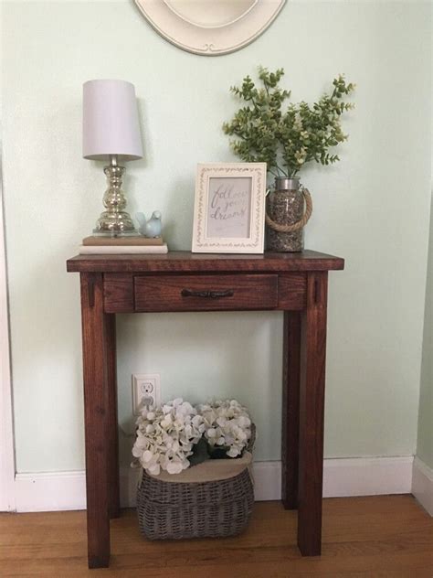 The gorden occasional table collection create a industrial feel in your living this hand crafted console features three drawers with traditional ring pulls and double x details on the side. Oak sofa table | Oak sofa