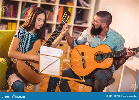 Guitar Teacher Teaching The Girl Stock Photo Image Of Happy Home