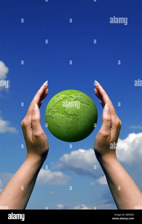 Female Hands Around A Green Earth Globe Protecting Our Planet And