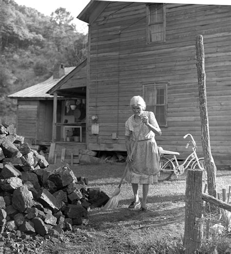 Woman Sweeping Coal Off Path Bob Rehak Photography Appalachian