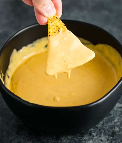 This nachos cheese dip was an invention out of necessity. 5 Minute Nacho Cheese Sauce Recipe - Build Your Bite