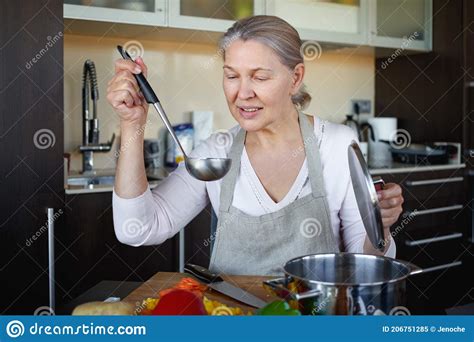 Mature Woman In Kitchen Preparing Food Stock Image Image Of Cuisine