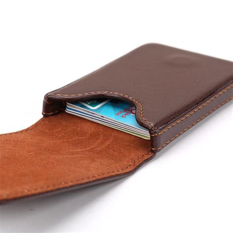 This holder features a tab on the top of each side that allows you to use a quarter or your fingernails to open the holder up easily. KA51C Leather Magnetic Card Holder - RetailBD