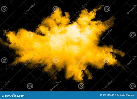 Deep Yellow Color Powder Explosion Cloud Isolated On Black Background
