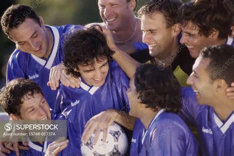 Soccer Team Laughing Together Superstock