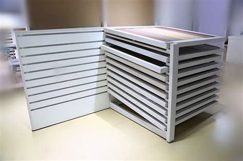 Space saving tile display stands and racks are an important component of the ceramic tiles and stone marketing. Flooring Tile Sample Display Drawer Stand SDR-41