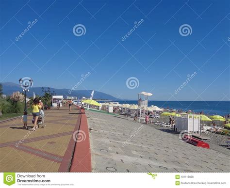 People Walk Along Seaside Promenade And Relax At The Beach Resort Sochi