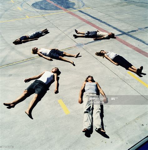 Group Of Young People Lying On Ground Elevated View People Lie